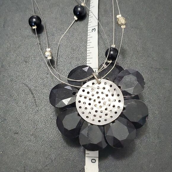 Silver tone black flower floating necklace - Picture 6 of 11